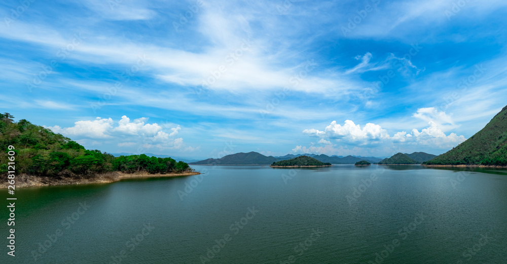 Landscape of mountain with beautiful blue sky and white clouds at Kaeng Krachan dam in Thailand. Beautiful view of  Kaengkrachan dam. Water reservoir for hydro power plant. Hydroelectric power dam.