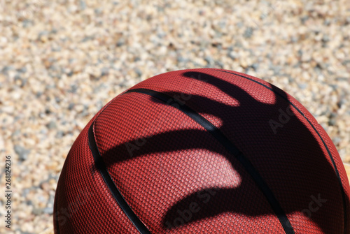 Basketball man hand shadow stone background 