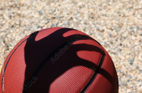Basketball man hand shadow stone background 