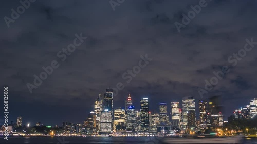 Wallpaper Mural Central Sydney in night timelapse. Panning between the most iconic buildings of the city - Sydney Opera House and Sydney Harbour Bridge with the cityscape of central office towers between them. Torontodigital.ca