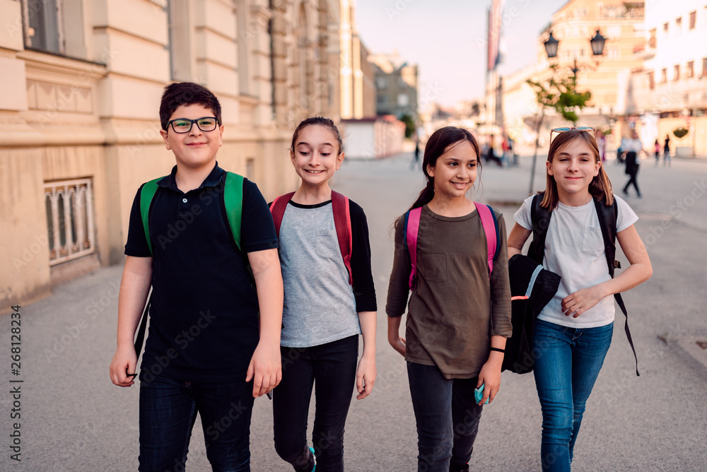 Obraz premium Group of classmates on the way to the school
