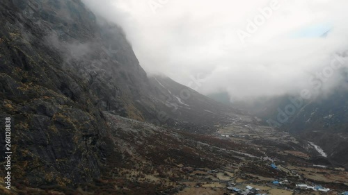 4k aerial fly in mountains valley in Langtang Valley in Nepal photo