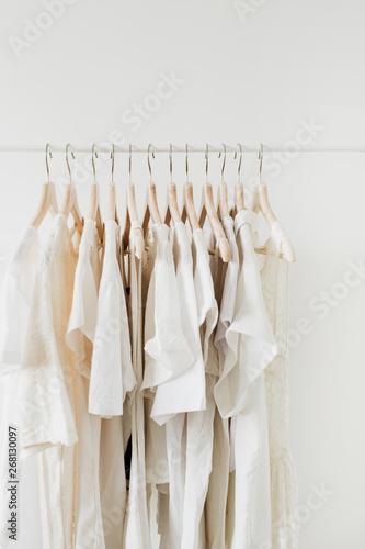 Feminine clothes on hanger. Minimal fashion composition on white background.