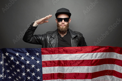 Patriot hipster man holding emotionally american usa flag