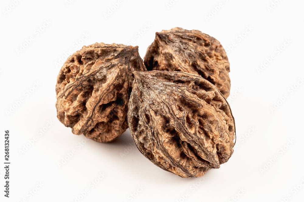 three walnuts side by side on white background three walnuts side by side on white background