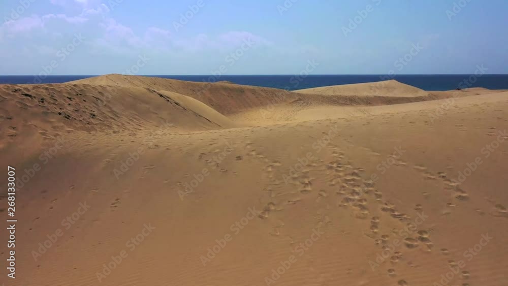 Aerial view of the dunes in the city of Maspalomas. Gran Canaria island. Summer beach with ocean. Aerial view of the dunes in the city of Maspalomas. Gran Canaria island. Summer beach with ocean.