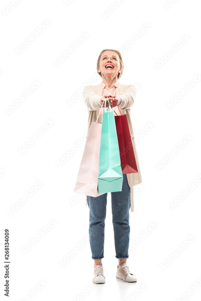happy middle aged woman with shopping bags On White happy middle aged woman with shopping bags On White