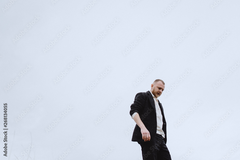 Portrait of a guy running through the mountains in search. Nutrition of confusion, feelings, despair, haste Portrait of a guy running through the mountains in search. Nutrition of confusion, feelings, despair, haste