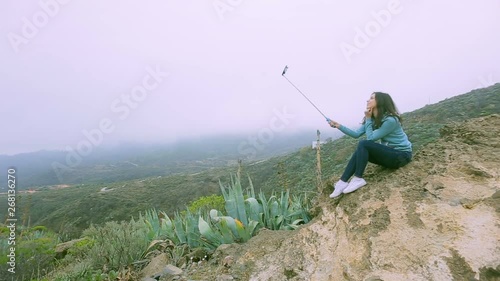 young girl making selfie on the background of the enchanting nature of the Canary Islands