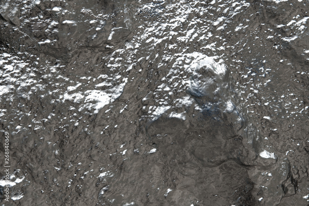 Rough stone wall covered covered with silver paint. Textured abstract background.