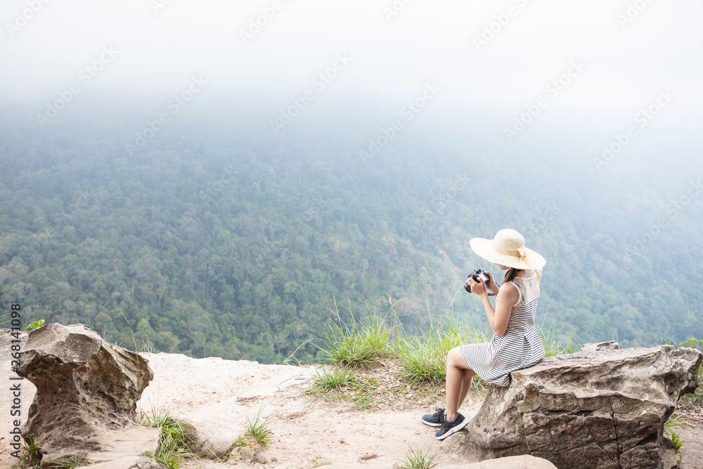 Cute girl is traveling on high mountain. Khao Yai national park, Thailand.