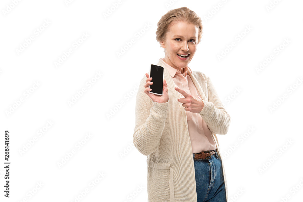 happy middle aged woman pointing with finger at smartphone with blank screen Isolated On White happy middle aged woman pointing with finger at smartphone with blank screen Isolated On White