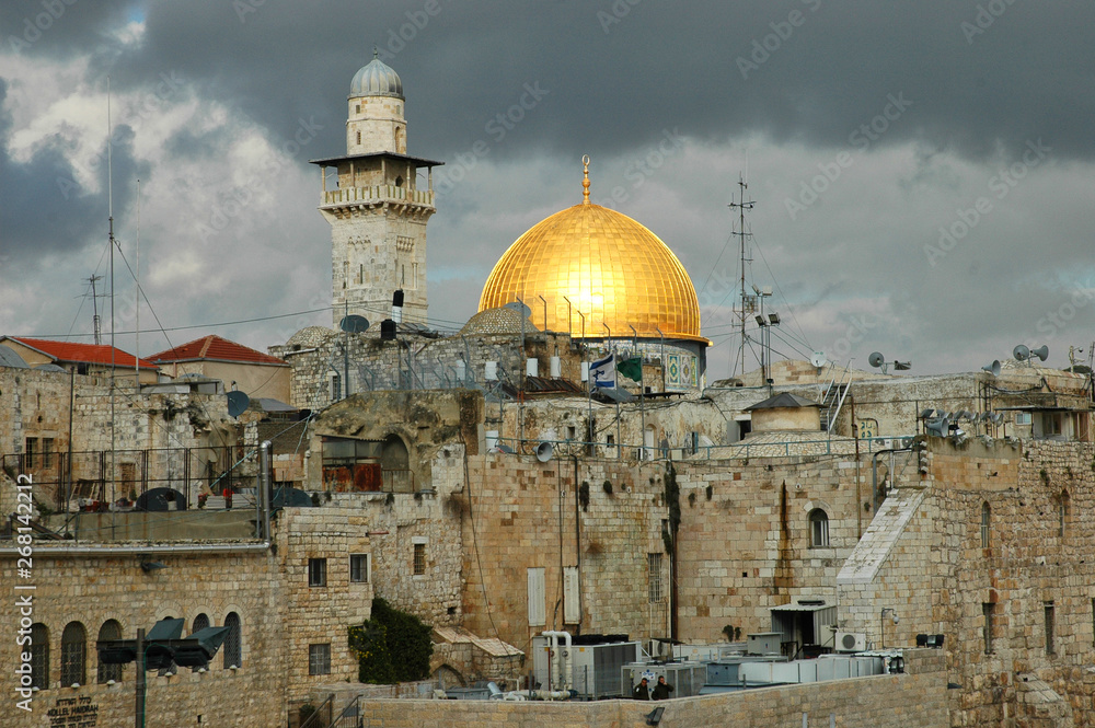Dome of the Rock and minaret surrounded by Jerusalem roof tops