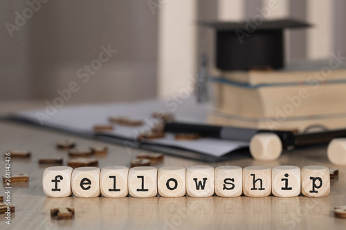 Fotografie, Obraz Word FELLOWSHIP composed of wooden dices.