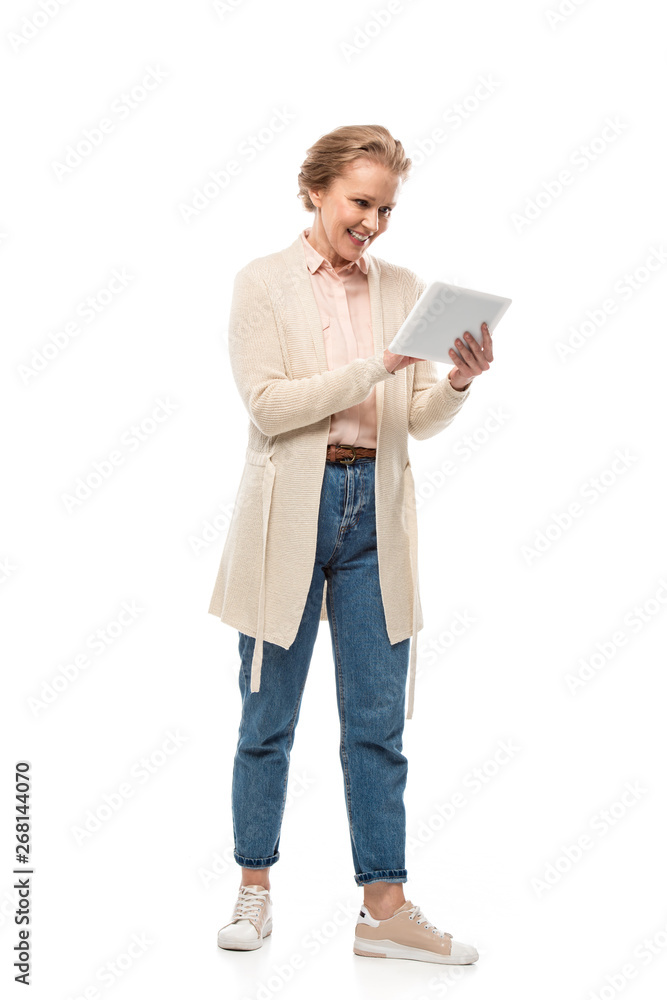 smiling middle aged woman using Digital Tablet Isolated On White smiling middle aged woman using Digital Tablet Isolated On White