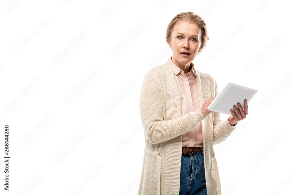 confused middle aged woman using Digital Tablet Isolated On White with copy space confused middle aged woman using Digital Tablet Isolated On White with copy space