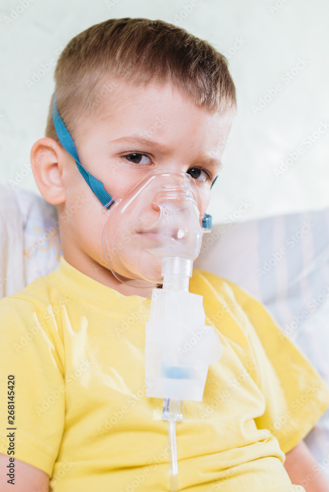 small child treats bronchitis inhaler at home