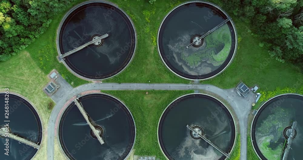 Aerial view of a city's waste management sewage and water treatment plants. Waste water purification. Aerial view of a city's waste management sewage and water treatment plants. Waste water purification.