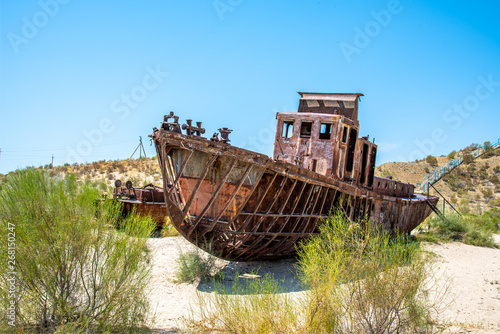 A rusting shipwreck in the desert near the former Aral Sea fishing town Moynaq / Muynaq in Uzbekistan / Karakalpakistan