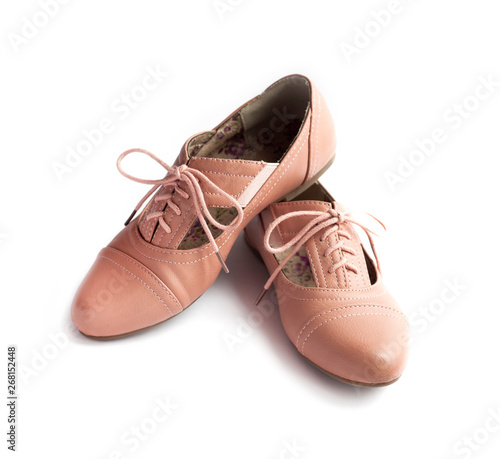 Pair of female shoes on white background