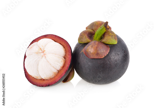 whole and half cut fresh Mangosteen on white background