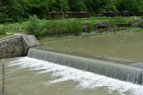 water flowing over dam