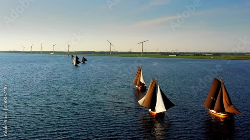 Aerial of typical Dutch blunter ships in a contest nearby village Spakenburg, The Netherlands photo