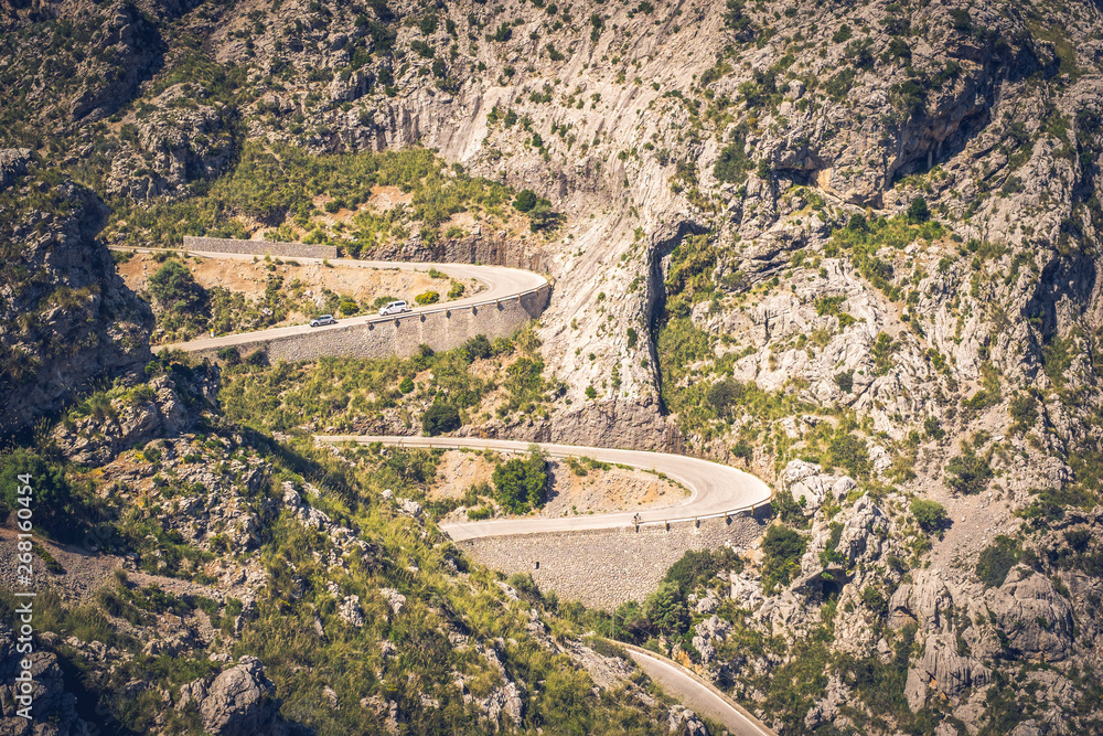 Serpentines and curves in Tramuntana, Mallorca, Spain. Fast drive, drift.