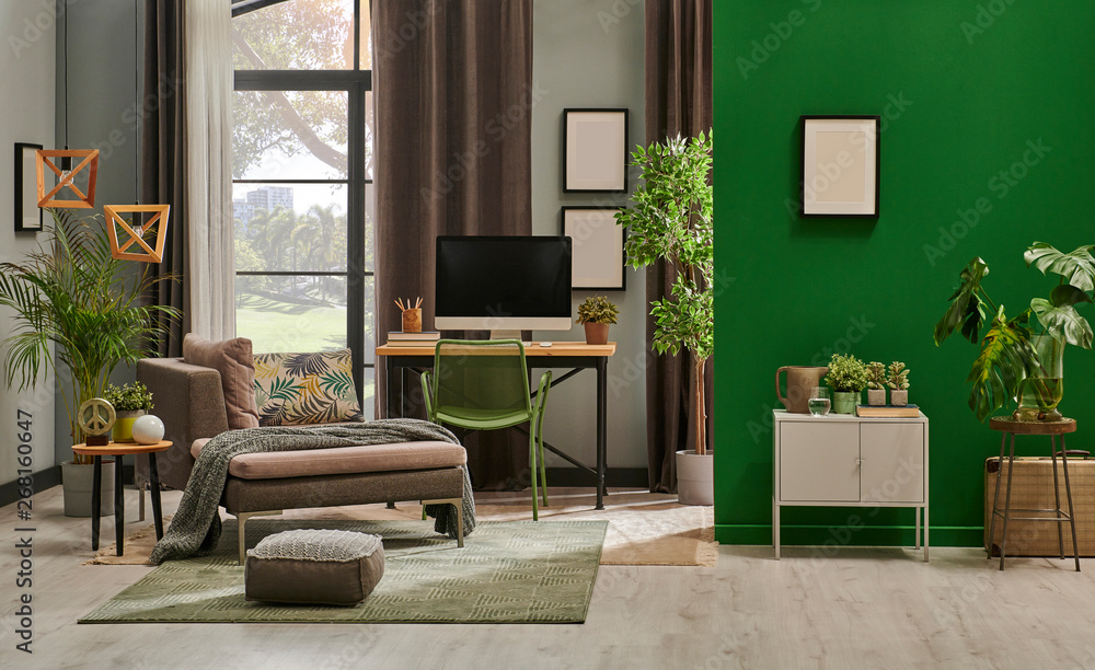 Modern living room with grey sofa and frame, green wall close up decoration in front of the