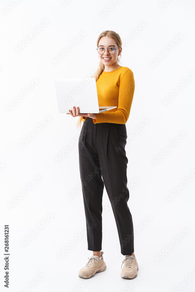 Full length of a smiling attractive young blonde woman Full length of a smiling attractive young blonde woman