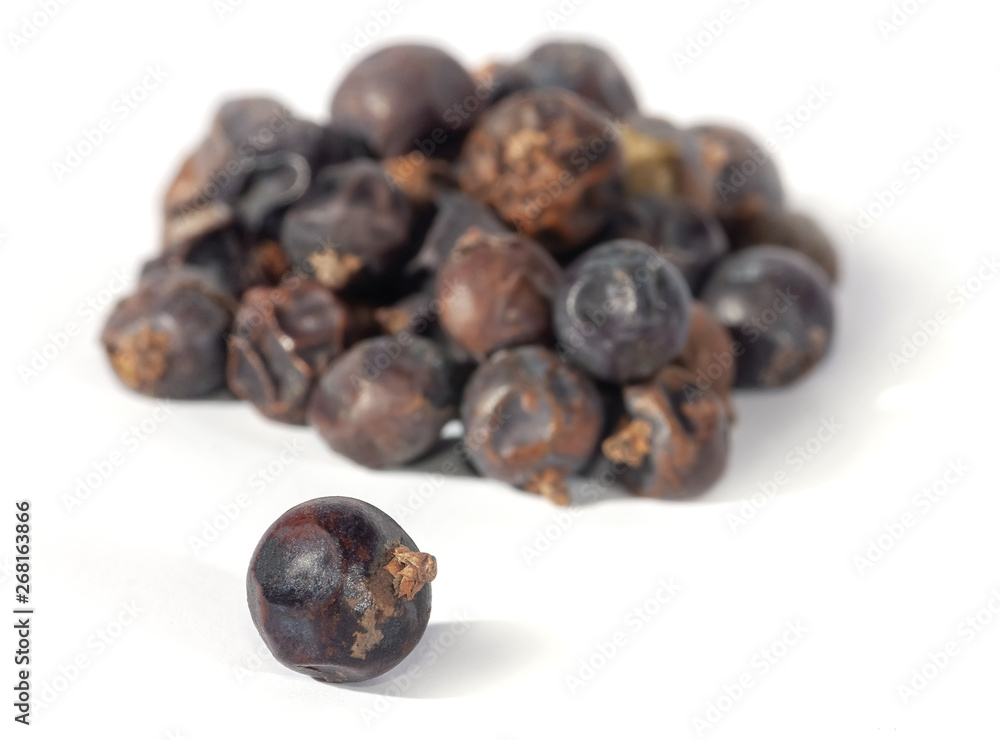 Dried juniper berries isolated on white. Soft focus view. Close up. Dried juniper berries isolated on white. Soft focus view. Close up.
