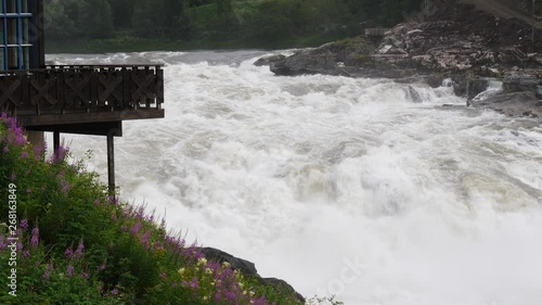 Formofossen powerful river waterfall on the Sanddola River. Water flows in slow motion. Grong Municipality, Nord-Trondelag County, Norway photo