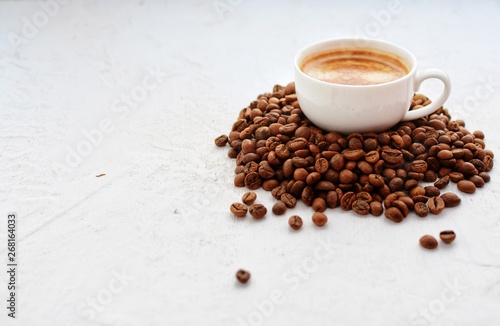 Cup of espresso and coffee beans