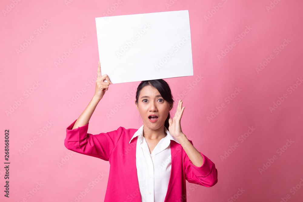 Young Asian woman surprise with white blank sign. Young Asian woman surprise with white blank sign.