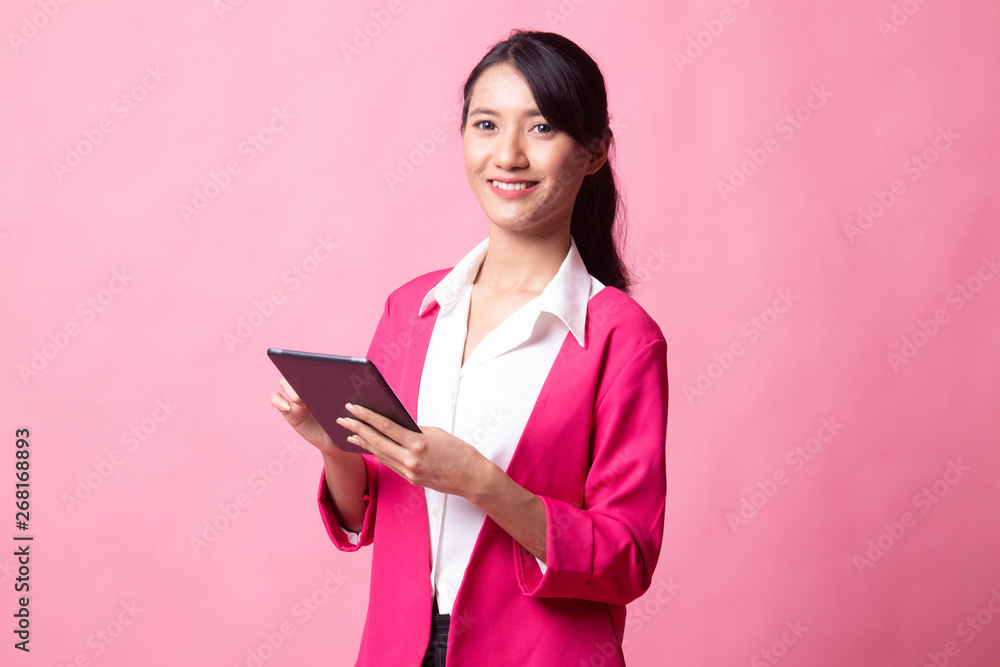 Young Asian woman with a computer tablet. Young Asian woman with a computer tablet.