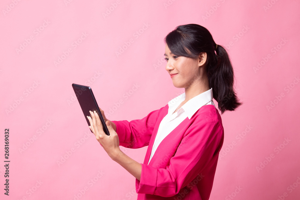 Young Asian woman with a computer tablet. Young Asian woman with a computer tablet.