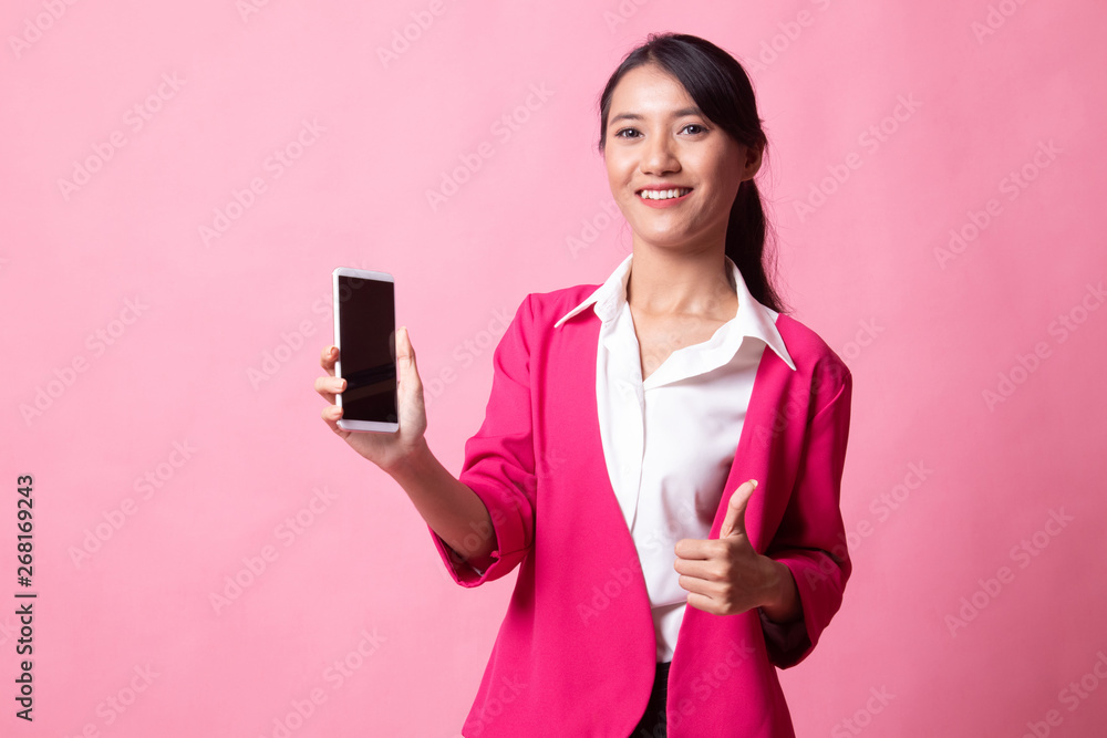 Young Asian woman show thumb up with mobile phone. Young Asian woman show thumb up with mobile phone.