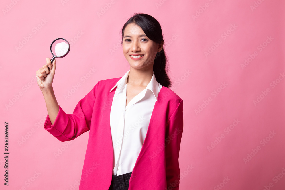Young Asian woman with a magnifying glass. Young Asian woman with a magnifying glass.