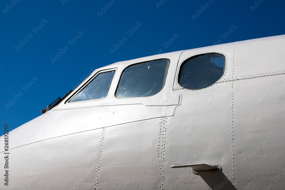 Fuselage cockpit. Part of the aircraft. The nose of the aircraft against the blue sky. Fuselage cockpit. Part of the aircraft. The nose of the aircraft against the blue sky.