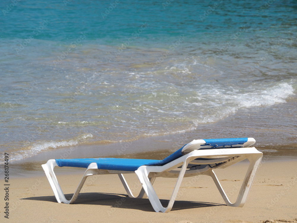 chaise lounge on the sandy beach of the Atlantic Ocean. chaise lounge on the sandy beach of the Atlantic Ocean.