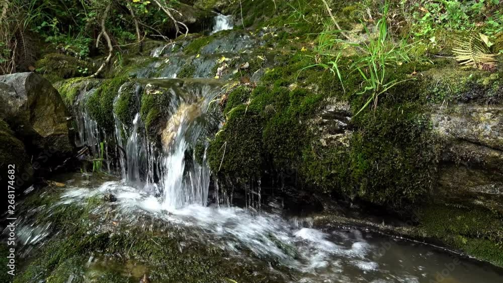 Stream of water coming down from the mountains. Stream of water coming down from the mountains.