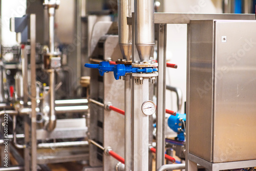 Stainless steel pipes in the factory. Construction on food production, Abstract industry background.