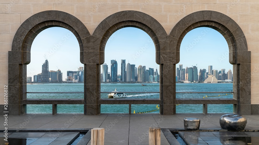 Doha skyline through the arches of the Museum of Islamic art, Doha, Qatar