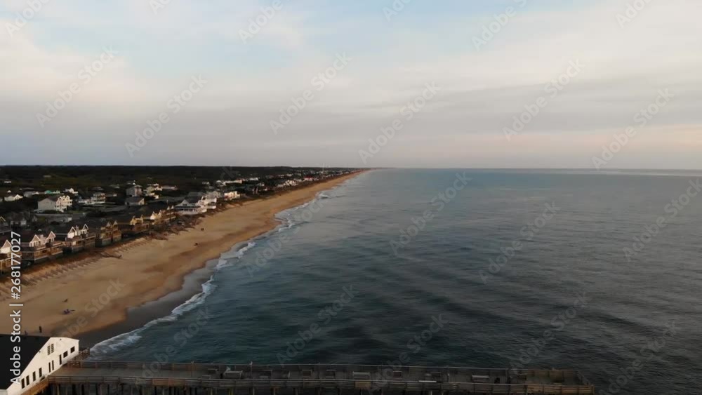 Overhead aerial Drone shot of a fishing pier on the North Carolina coast on a overcast day. Overhead aerial Drone shot of a fishing pier on the North Carolina coast on a overcast day.