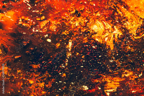 Abstract art texture background. Volcano molten lava design. Red, orange and black paint mixture splash.