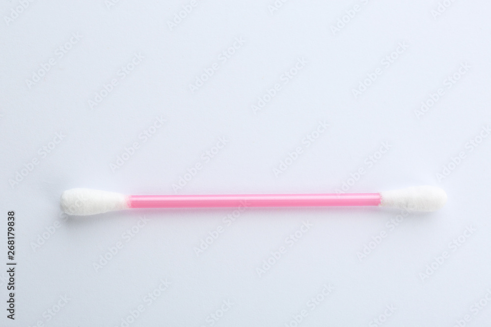 Pink plastic cotton swab on white background Pink plastic cotton swab on white background