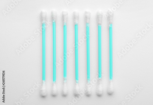 Plastic cotton swabs on white background  top view