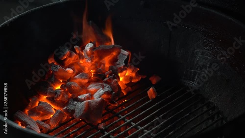 Red hot burning coal. Flames and red embres. Ash in fire photo