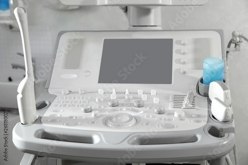 Modern ultrasound machine in clinic, space for text