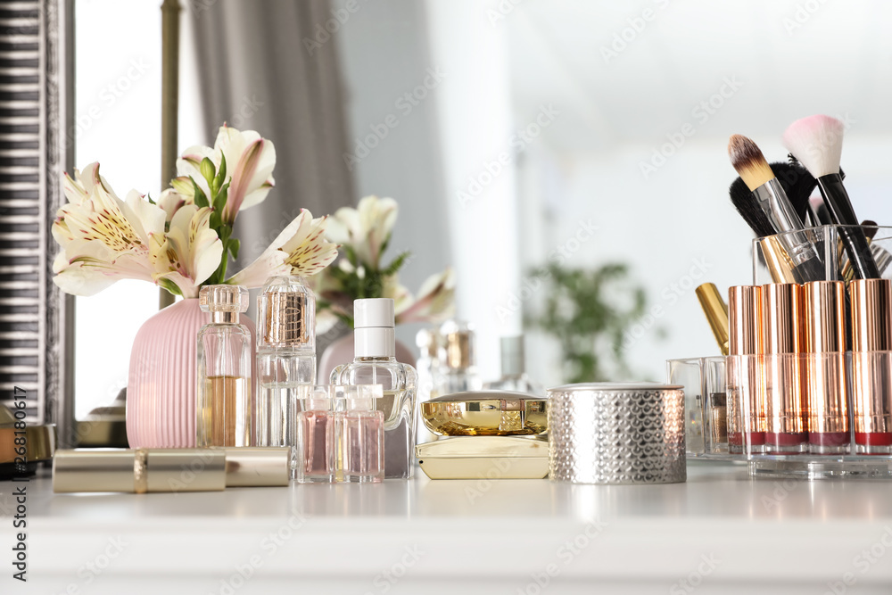 Luxury makeup products and accessories with perfumes on dressing table - obrazy, fototapety, plakaty 